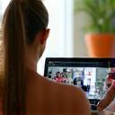 Online Fitness Programs: Person following virtual workout from home
